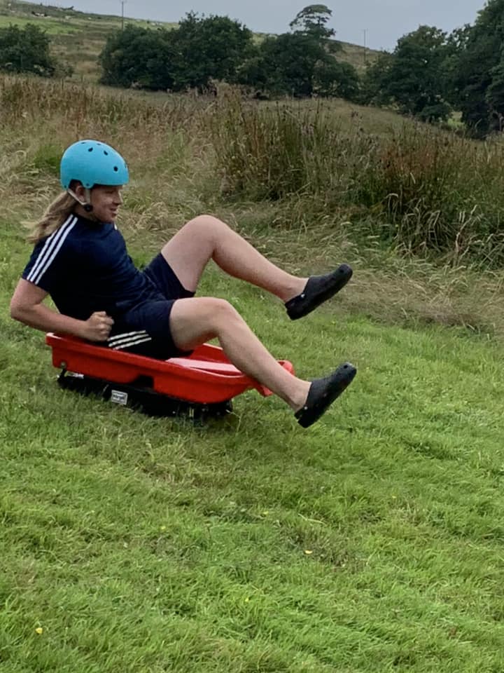 Grass Sledding on Camp